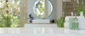 Modern luxury white bathroom tabletop over blurred background of a modern luxury bathroom