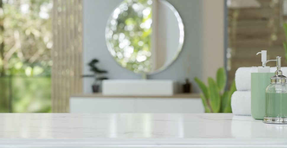 Modern luxury white bathroom tabletop over blurred background of a modern luxury bathroom